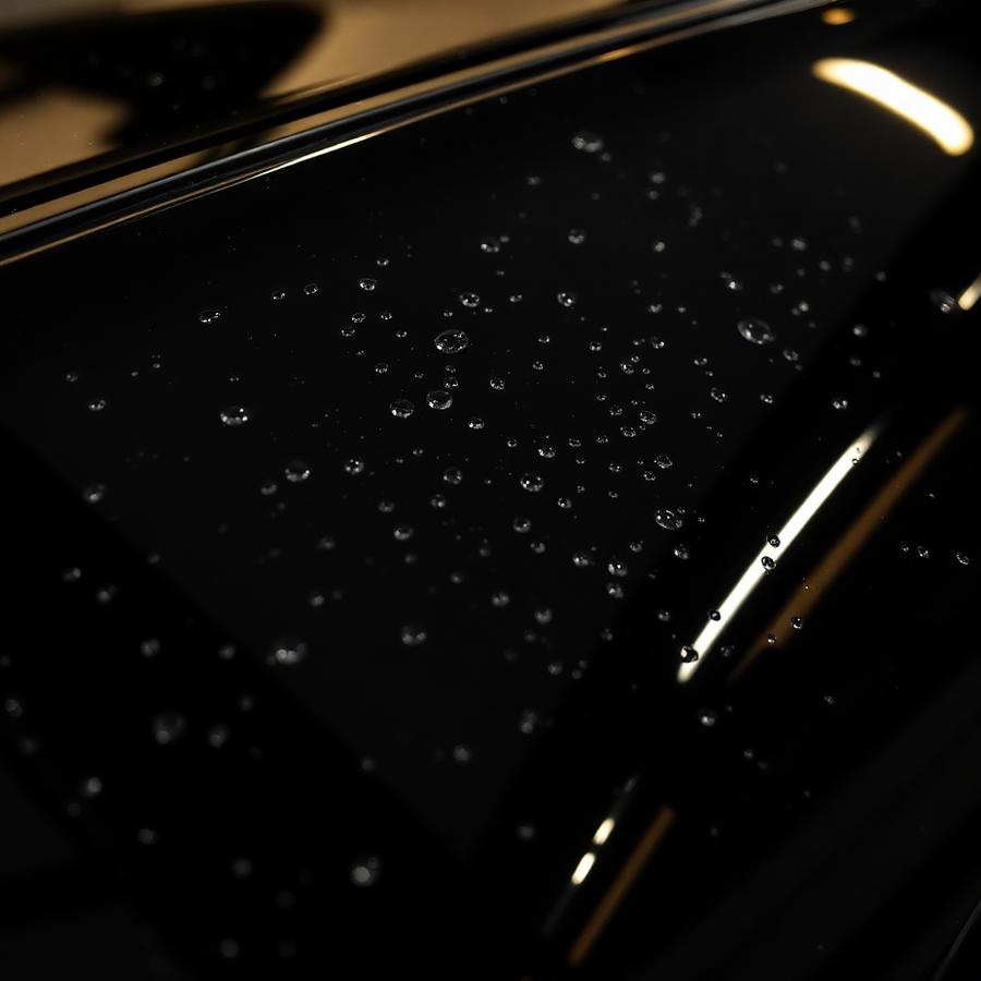 Glossy black paint with water beading after ceramic coating